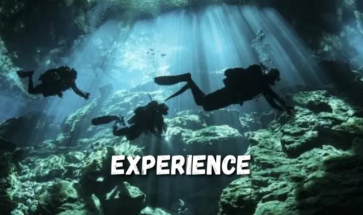 Silhouette skilled divers figures underwater 