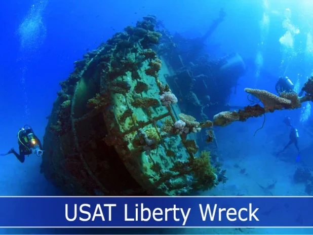 Divers encircle the USAT Liberty on Tulamben dive site